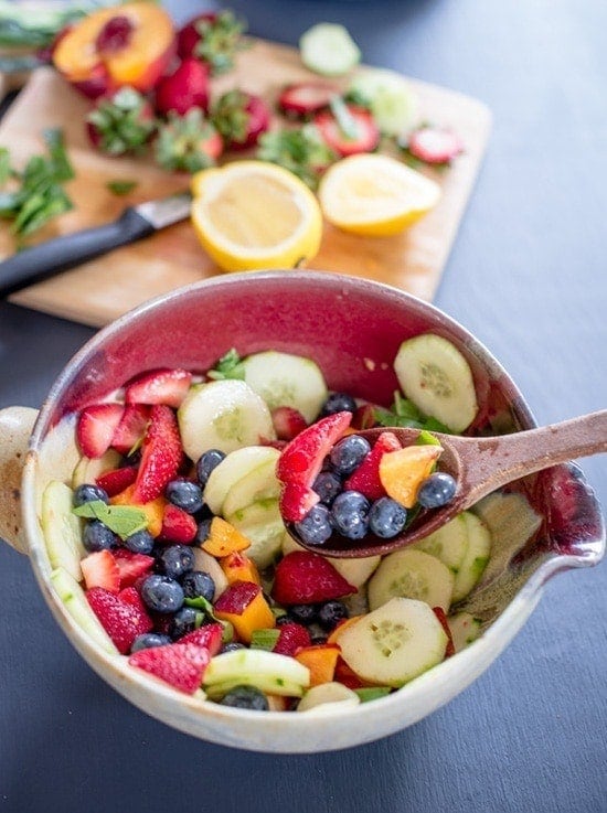 Fruits with cucumber in a bowl