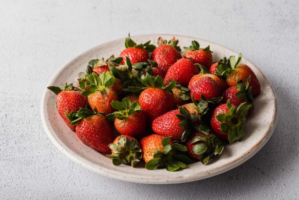 Fresh strawberries on a plate.