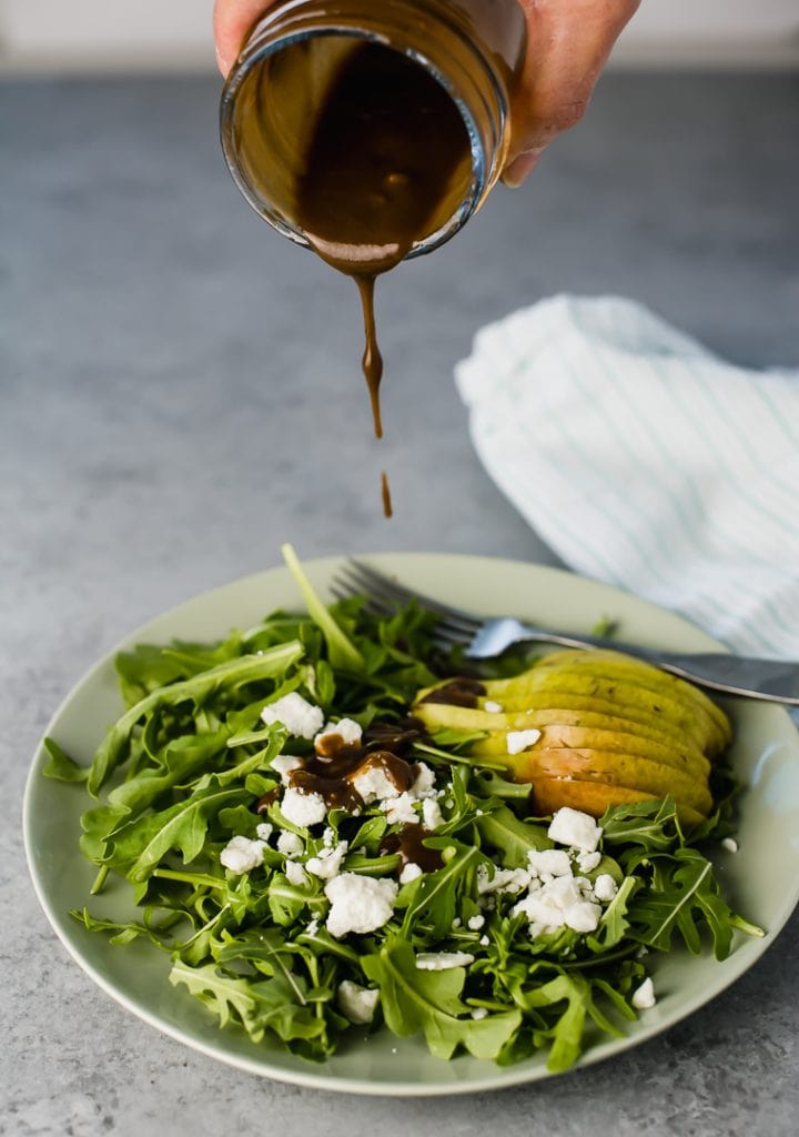 Arugula salad with pear and feta cheese with a balsamic vinaigrette.